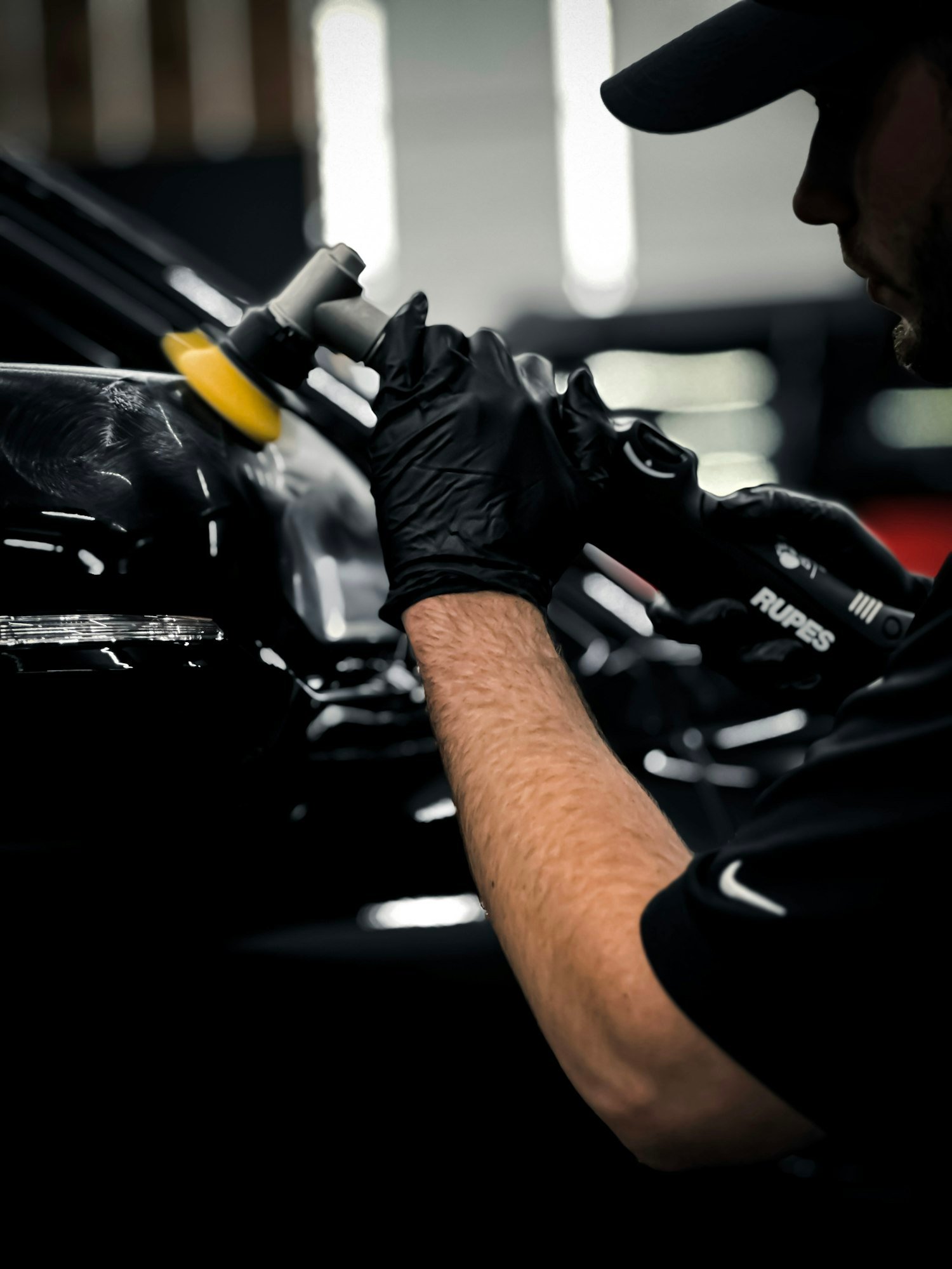 A V Cars technician detailing a car
